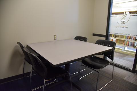 Study room in Youth Services with seating for four.