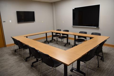Conference room with tables and chairs; 12 max